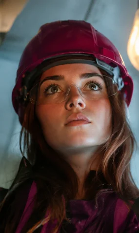 Technician in a hard hat and safety glasses